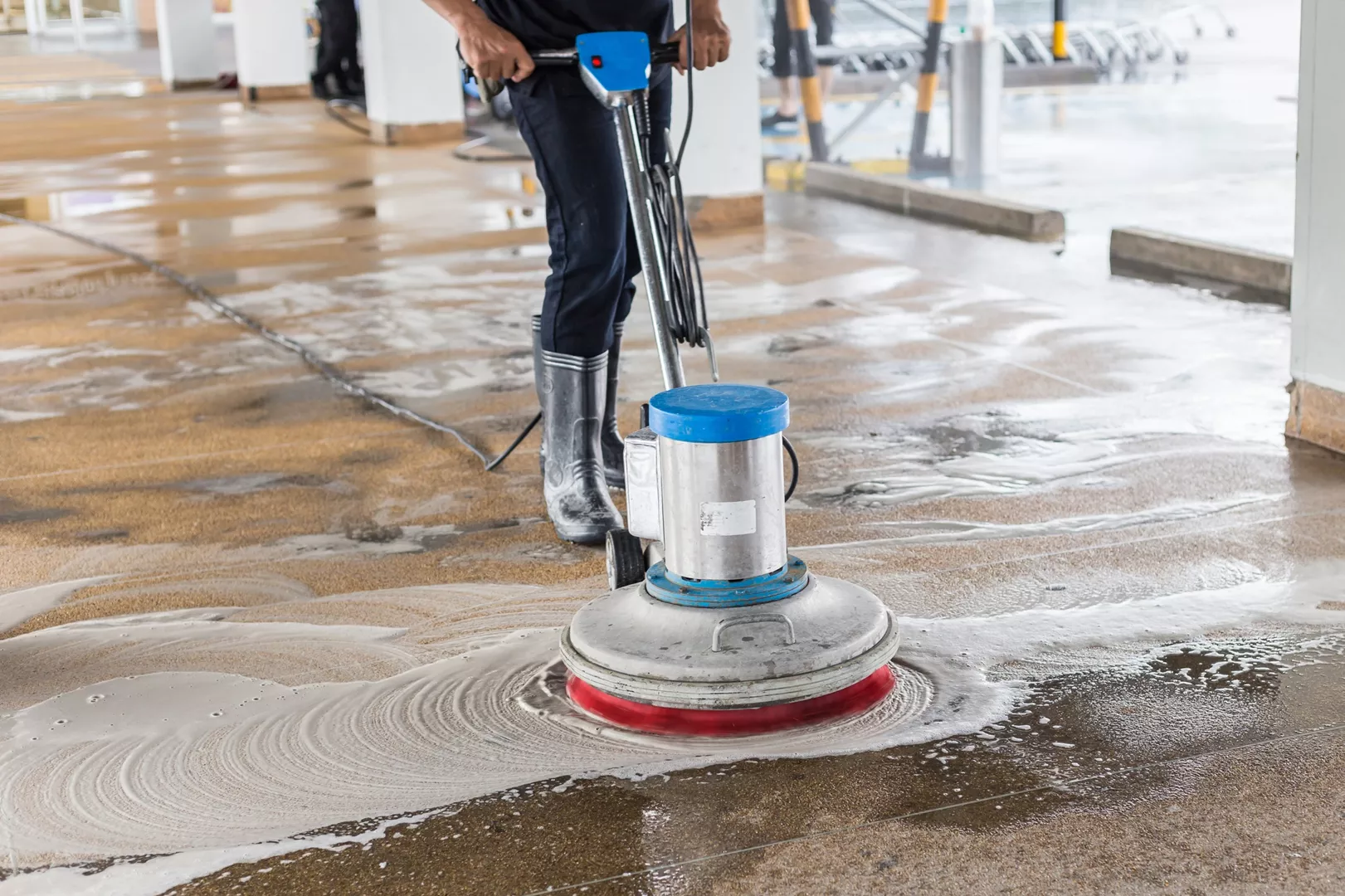 asian-worker-cleaning-sand-wash-exterior-walkway_08-07-2023