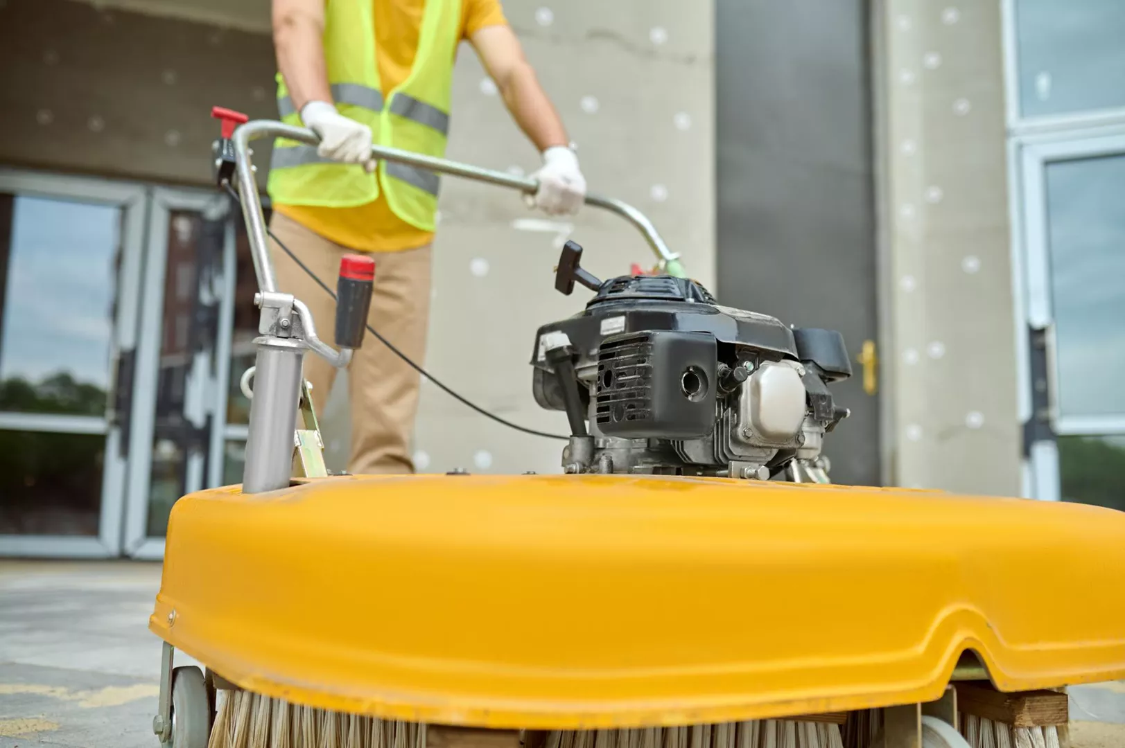 workman-applying-road-sweeper-construction-site_08-07-2023
